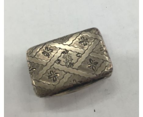 A George IV silver vinaigrette with checkered floral design, monogram to cartouche, chevron pierced and floral grill: London 