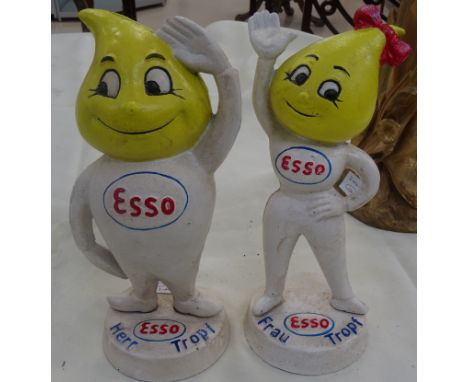 A pair of cast-metal Esso figures