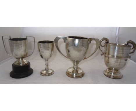 Four silver trophy cups, various dates and makers