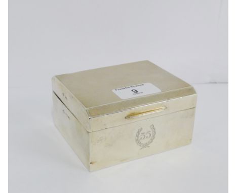 George V silver box, the hinged lid with engine turned decoration, with laurel leaf and 55 engraved script to front, with mak