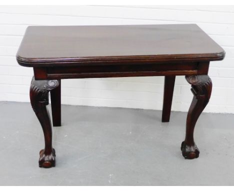 A contemporary mahogany console table with shell carved cabriole supports and claw and ball feet,   70 x 105cm 