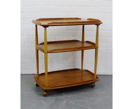 An Ercol light elm three tier trolley, 78 x 72cm
