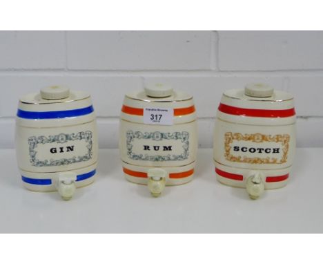 Three Wade Royal Victorian pottery ceramic barrel decanters to include Rum, Gin and Scotch, 30cm high, (3) 