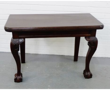 A contemporary mahogany console table with shell carved cabriole supports and claw and ball feet,   70 x 105cm 