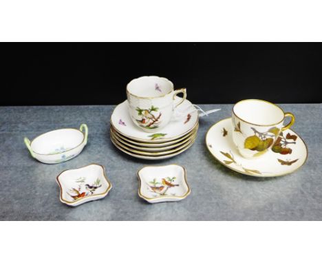 A collection of Herend porcelains to include a cup, five saucers, two trinket dishes, a small twin handled basket and a Minto