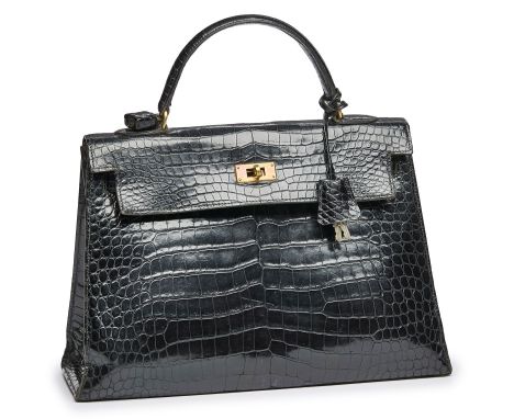 Handtasche "Kelly Bag",Hermès 1960er Jahre. Schwarzes Krokodil-Leder, goldfarbene Metall- Elemente. Typ. Form m. 1 Henkel, Ve