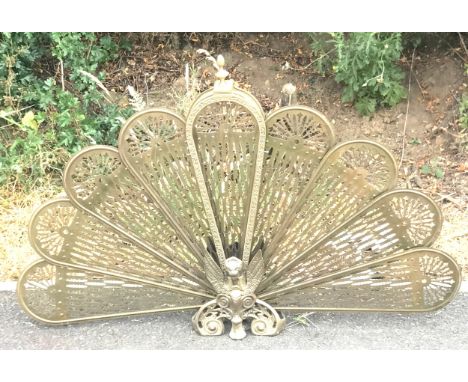 Vintage Brass Peacock firescreen, approximate height 25 inches, width when fanned out 38 inches 