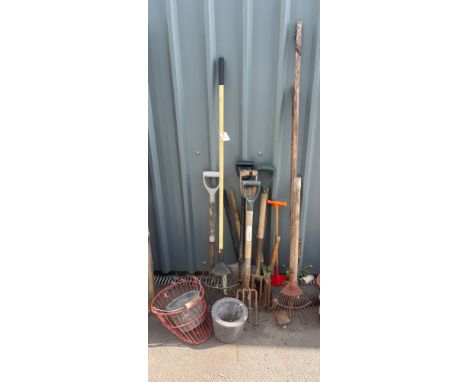 Selection of garden tools to include rakes, spades and forks etc 
