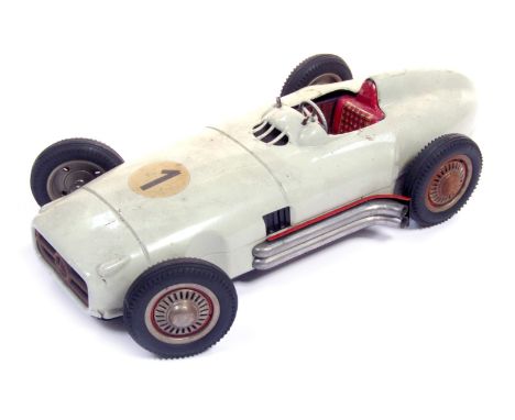 A West German tinplate sports car, in dark green, 33.5cm long. 