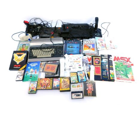 An Atari 2600 Video Computer System, WHS Smiths Computer Programme Data Recorder, joysticks, Wii games to include Wii Fit and
