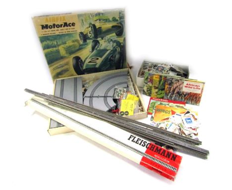 An Airfix Motorace kit, together with a section of Fleischmann track, various football stickers, loose and in albums, etc. (a