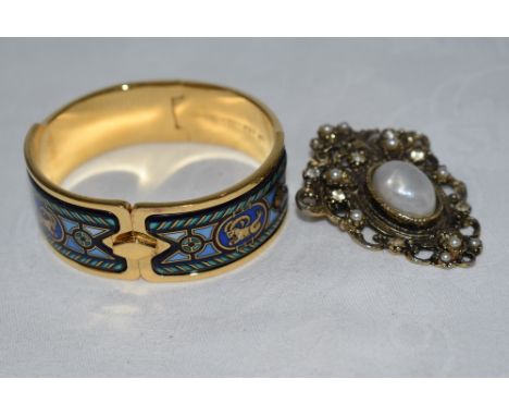 A Michaela Frey hinged gold plated bangle having enamelled Greek style design and concealed clasp, and a costume jewellery br