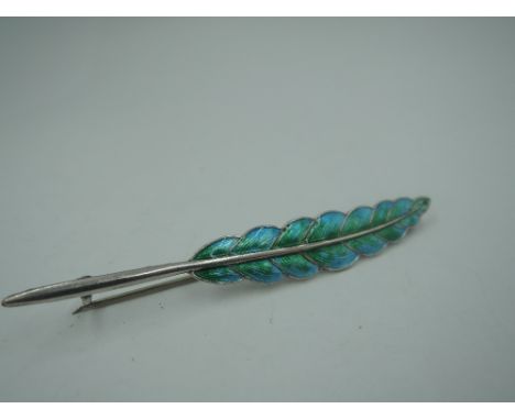 A silver and enamel brooch modelled as a feather in shades of green and turquoise, Chester 1911, Charles Horner approx 76mm &