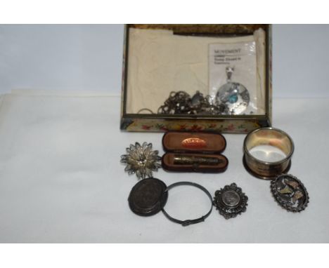 A vintage tin containing a small selection HM silver and white metal including Mexican pendant, napkin ring, brooches, filigr