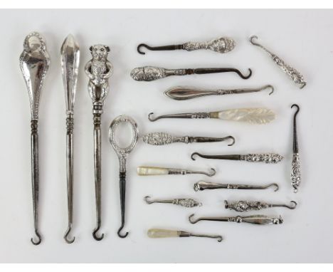 A collection of silver-handled button and glove hooks, including a teddy bear hook by Henry Williamson Ltd, Birmingham 1909, 