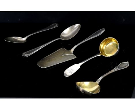 Selection of silver-plated flatware to include serving spoons and a small cake slice, along with a 1925 American silver dolla