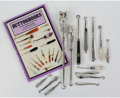 A group of silver-handled glove and button hooks, including an Edward VII silver owl handled hook with red paste-set eyes, by