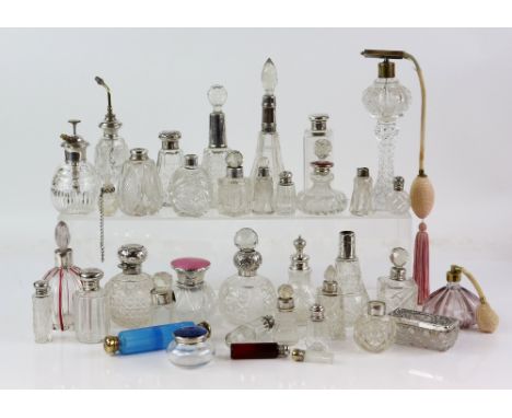 Large collection of silver and white-metal mounted cut glass and other scent bottles, including a double-ended blue glass sce