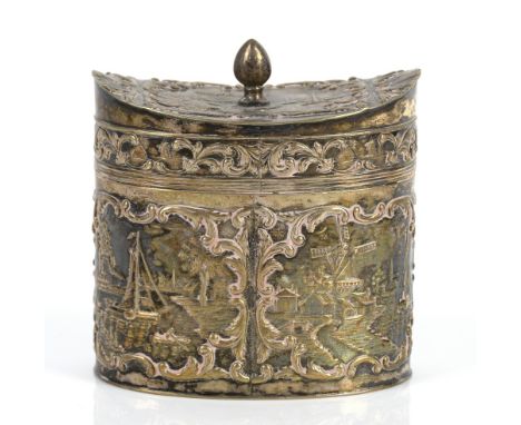 Oval Dutch .833 silver tea caddy with repoussé decoration of Windmills and canals, 8cm high together with a caddy spoon marke