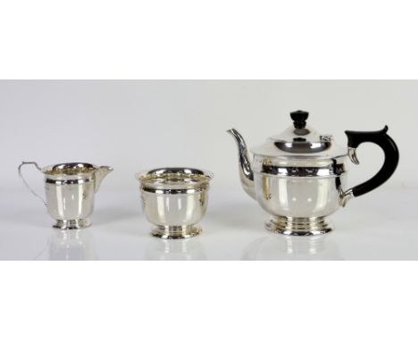 Silver three piece tea service of circular form the teapot with ebonised knop and handle Sheffield 1940 maker mark Viners Lim