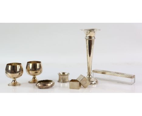 Selection of silver items to include a sterling silver vase with weighted base, two goblets, napkin rings, snuff box and dres