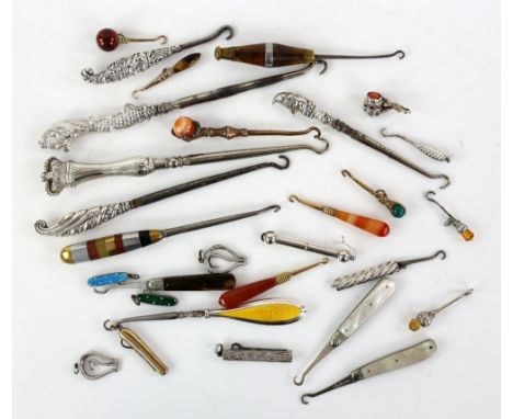 A collection of silver-handled button and glove hooks, including a Mr Punch hook by Crisford &amp; Norris, Birmingham, 12 cm 
