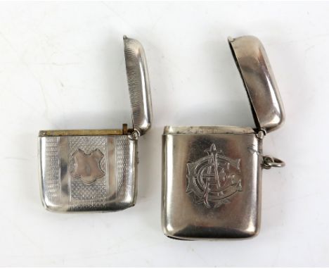 Edward VII silver vesta case, with monogram engraving, Birmingham 1907, 5.5 cm high, together with another, engine turned fin