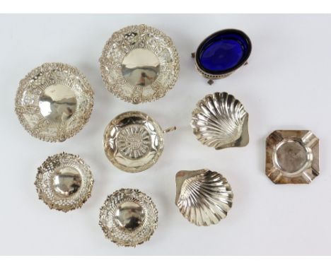 Selection of silver items including two pairs of pierced bonbon dishes, a pair of shell butter dishes, an open salt, ashtray 