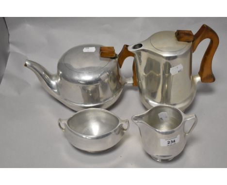 A vintage Mid century Picquot ware stainless steel tea set.