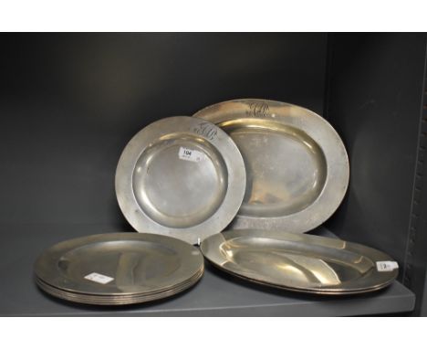 A group of nine 19th century pewter plates, each with engraved initials AAB and Carpenter touch marks
