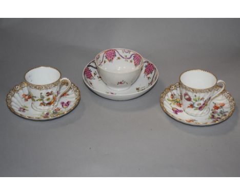 An 18th century English Newhall Porcelain type teabowl and saucer with typical foliate decoration, sold along with a pair of 