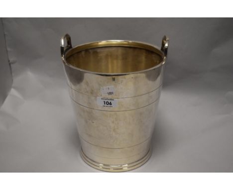 A vintage silver-coloured metal ice bucket, of typical form, unmarked