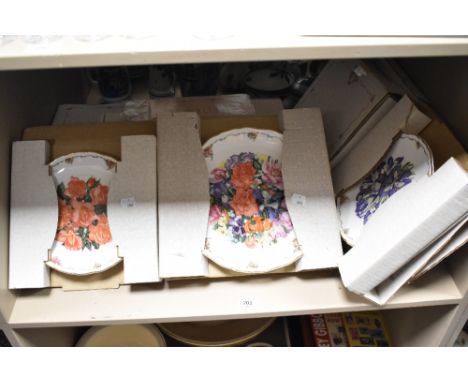 A selection of Royal Albert floral design collectors plates, with original card packaging