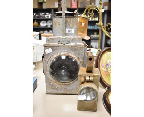 A vintage painted metal railway lantern, sold together with a Bardic NH10A M.O.F.P safety lamp