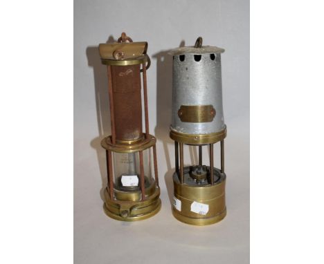 A W,H Taylor, Wigan miners lamp, of traditional design, sold along with another example with exposed mesh upper portionn