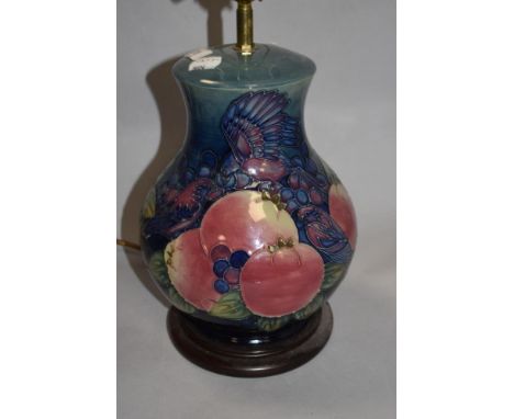 A Moorcroft Pottery 'Blue Finches' pattern baluster form table lamp, tube-lined with Birds and fruit against a washed blue gr