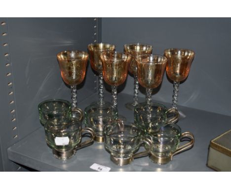 A group of six vintage Turkish tea glasses, tinted green with attached metal handles, sold along with six lustrous glass gobl