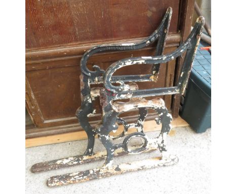2 HINGED CAST METAL BENCH ENDS