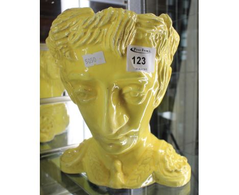 An unusual canary yellow pottery character vase by Eva Castle-Britton in the form of the head of a matador, entitled 'Don Qui