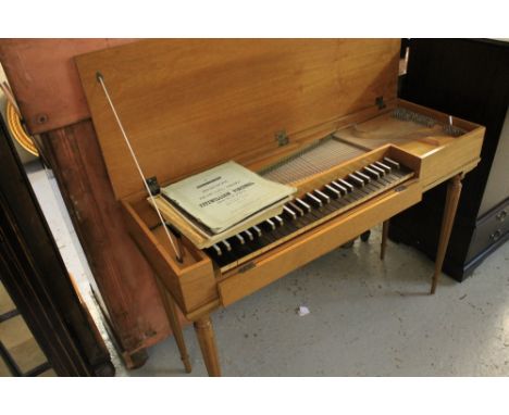 A modern John Morley of London pale mahogany spinet or square piano standing on vase shaped fluted tapering legs. 