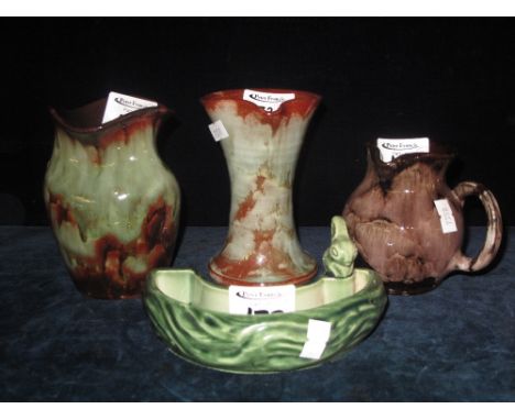 Three pieces of Ewenny pottery two vases and a jug, together with Wade rabbit mounted small planter (4).