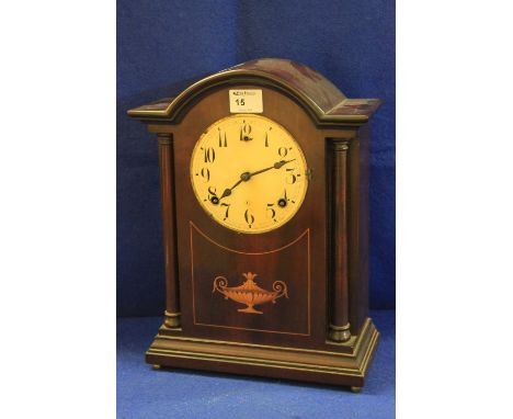 Early 20th century inlaid mahogany two train architectural arch topped mantle clock.