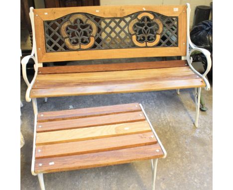 Modern garden bench with cast metal ends together with matching table. 
