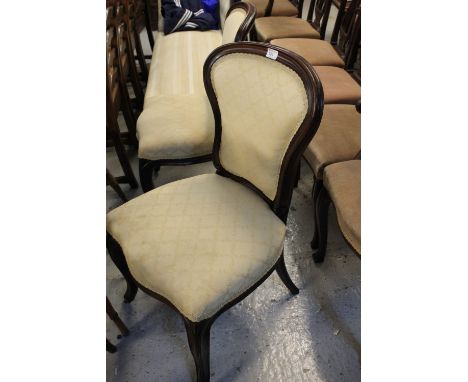 Pair of 19th century mahogany show frame upholstered dining chairs in French style with cabriole front legs and ceramic caste