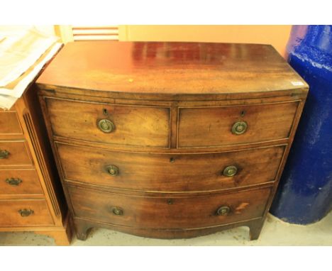 Early 19th century mahogany bow fronted chest of two short and two long cock beaded drawers on bracket feet. 