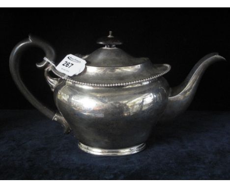 Silver oval teapot with beaded rim.  Birmingham hallmarks.