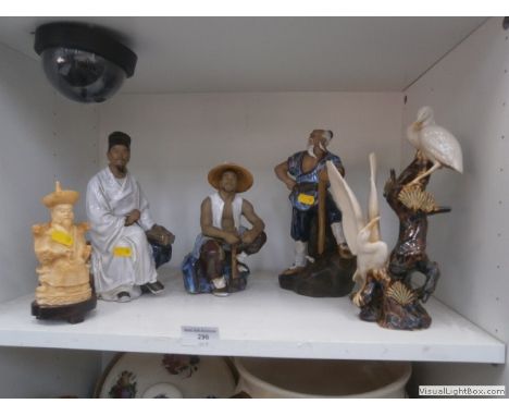 shelf of oriental figures