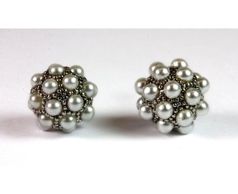 A pair of white metal (tested high carat gold) earrings set with grey cultured pearls, approx. 9.2g. Please note this lot is 