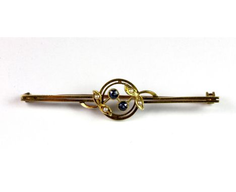 A Victorian 15ct yellow gold (stamped 15ct) sapphire and seed pearl set bar brooch.