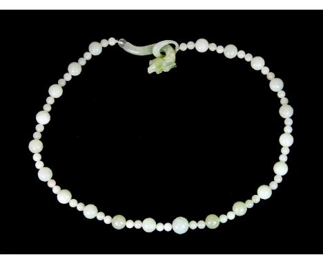 A Chinese green jade bead necklace with dragon head fastener, L. 60cm.